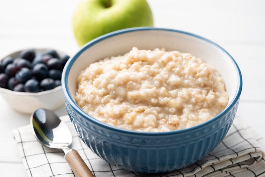 Bowl of oatmeal with fruit, perfect for energy and a smoother healing process